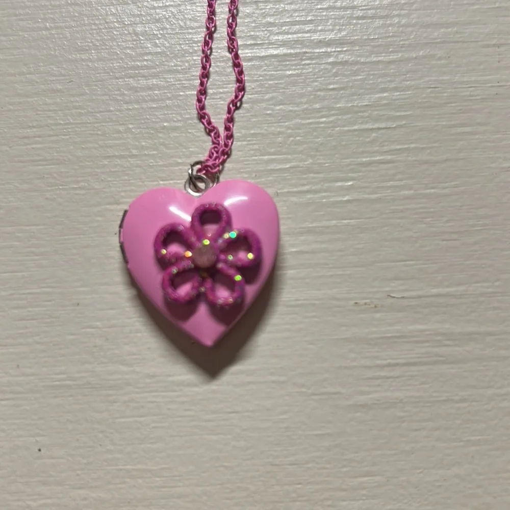 Kids 16” pink chained necklace with pink flower locket that opens. Gently used